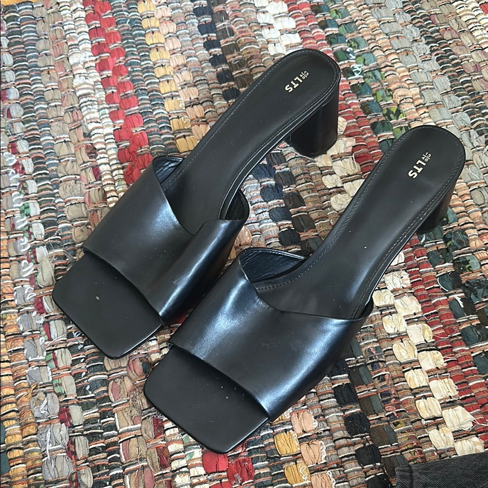 Sleek Black Heeled Mules